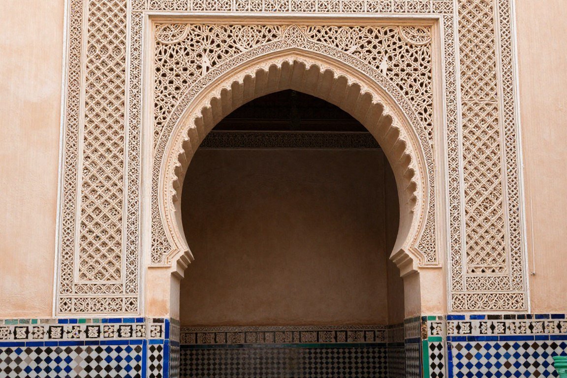 Traditional Moroccan carved plasterwork and mosaic tile patterns